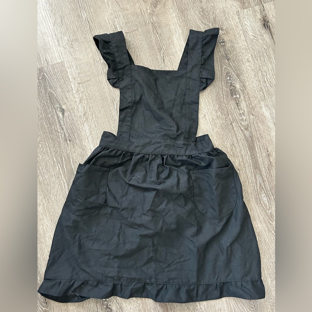 Women cooking black apron
